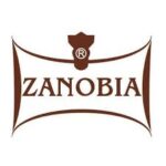 Zanobia logo featuring the brand name in stylized brown text on a white background, enclosed within a distinctive emblem shape with a small decorative symbol at the top.